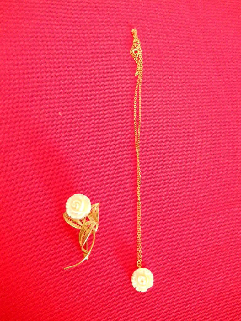 IVORY CARVED ROSE NECKLACE/BROOCH PIN: Carved IVORY Rose with G.F. Chain Necklace 9'' INCHES LONG/ IVORY ROSE BROOCH PIN WIDE CARVED IVORY ROSE BLOOM ON A LONG STEM WITH FILIGREED LEAVES. BROOCH MEASURES 3 INCHES BY 1 5/8 INCHES