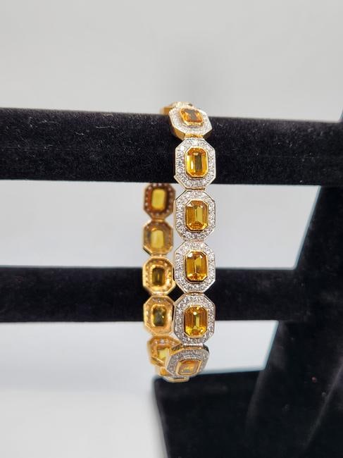 18KT White Gold Diamond And Yellow Sapphire In Bezel Setting Bracelet: 18KT Stamped White Gold Lady's Diamond and Yellow Sapphire bezel set bracelet with box clasp. 240 bead set round brilliant cut diamonds measuring 1.70 - 1.50 x .96mm. Approx total weight of 240 stones