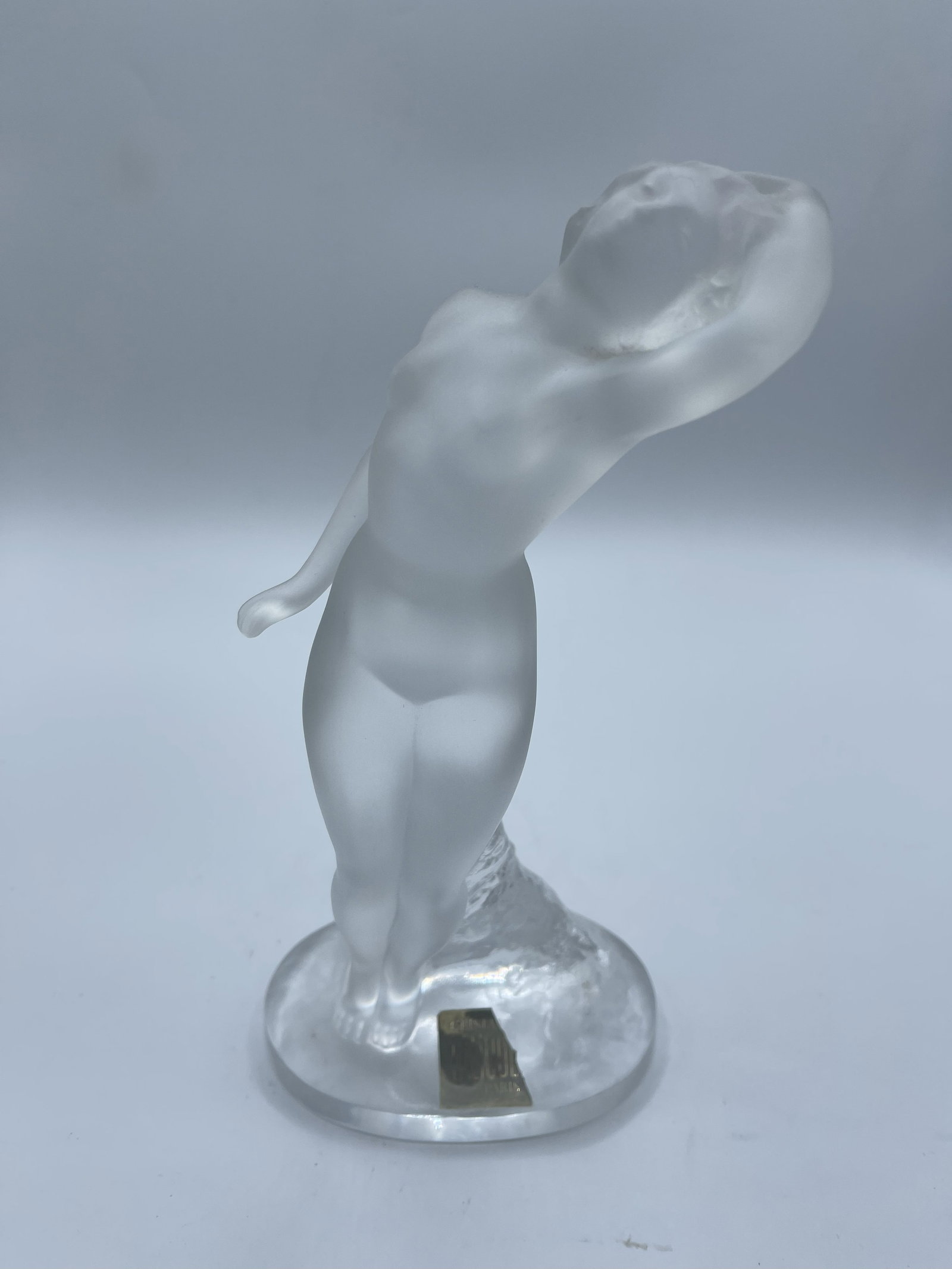 Lalique Crystal Nude - Danseuse Bras Leves Figure: Lalique Crystal Nude - Danseuse Bras Leves Figure Lalique is a French luxury glassmaker, established in 1888 by famed glassmaker and jeweler Rene Lalique. The brand gained prominence in the early 20th