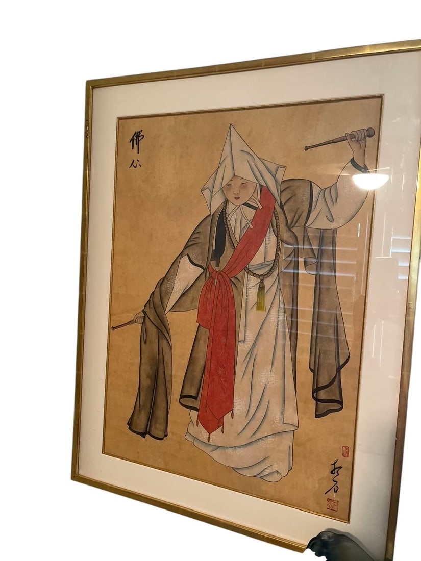 Traditional Buddhist Dance Artwork - Framed: Traditional Buddhist Dance Artwork - Framed This beautifully framed artwork depicts a traditional Buddhist dance, featuring a robed figure in motion. Measuring 31 inches by 24 inches, the piece captur