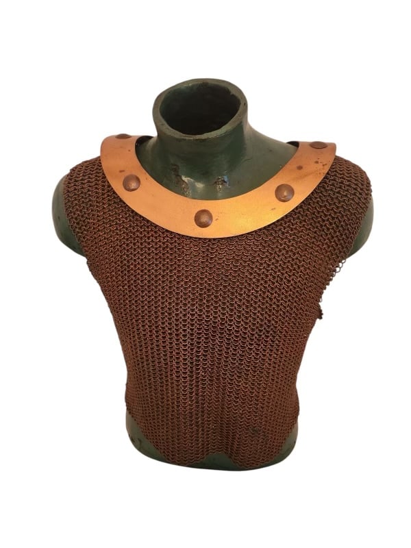 Medieval Chainmail Vest with Metal Collar: Medieval Chainmail Vest with Metal Collar A finely crafted medieval-style chainmail vest featuring a robust riveted metal collar. The chainmail is constructed with interlocking rings, offering both hi