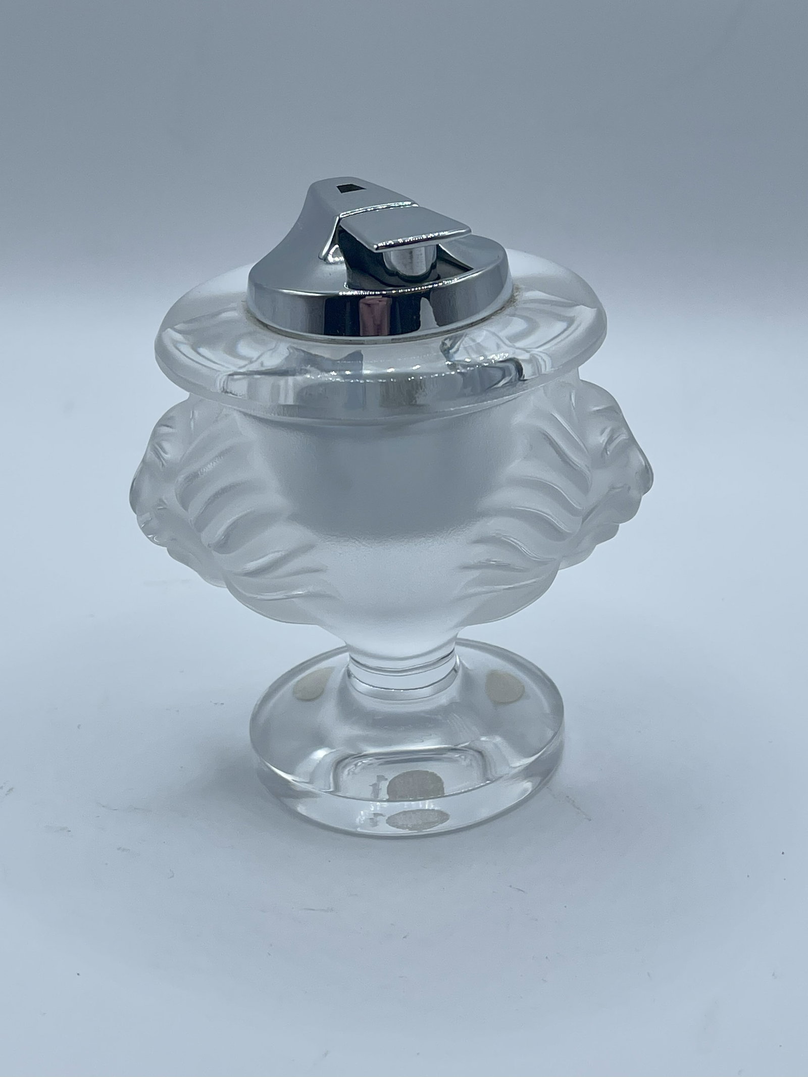 Lalique - Tate de Lion - Cigarette Lighter: Lalique - Tate de Lion - Cigarette Lighter Lalique is a French luxury glassmaker, established in 1888 by famed glassmaker and jeweler Rene Lalique. The brand gained prominence in the early 20th centur