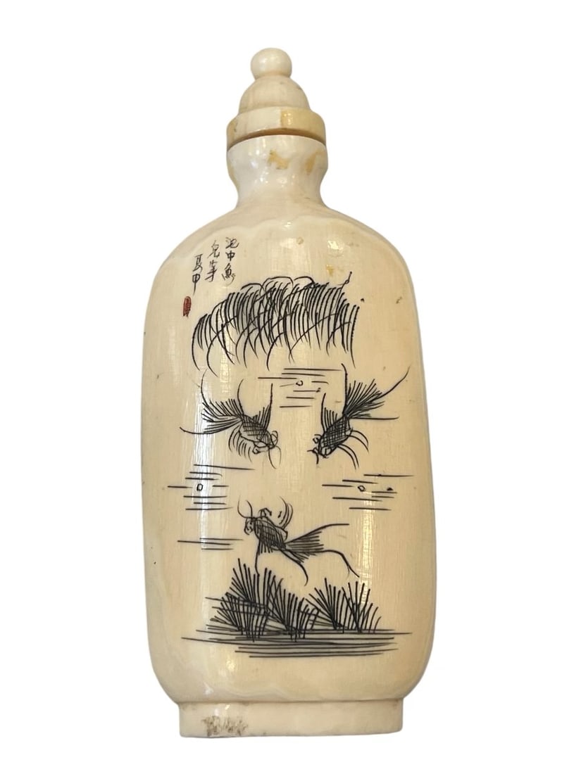 Bone Snuff Bottle With Koi Carving & Calligraphy: Bone Snuff Bottle With Koi Carving & Calligraphy Dimensions: 3.5 inches Description: During the Qing Dynasty (1644 - 1912), snuff bottles became popular symbols of status, crafted from materials like