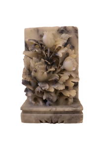 Marble Stone Asian Carving: Marble Stone Asian Carving This is a carved marble or alabaster featuring an intricate floral design. The sculpture depicts delicate flowers with finely detailed petals, leaves, and buds, giving it