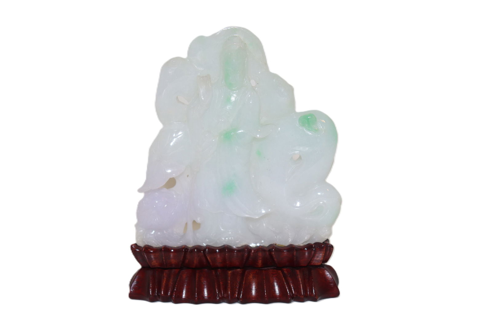 Carved Jadeite Figurine on Lotus Stand: Carved Jadeite Figurine on Lotus Stand This beautiful jadeite figurine is carved with precision, showcasing soft green highlights within a milky white jade base. Mounted on an elegant wooden lotus-sty