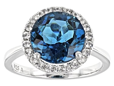 Blue Topaz Ring Rhodium Over Silver Halo