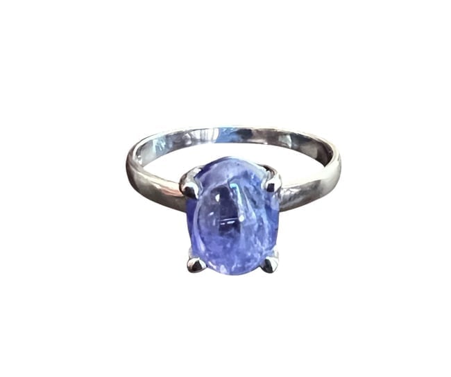 Sebastian 3.75ct Oval Cabochon Tanzanite Solitaire Ring in .925 Silver: Sebastian Tanzanite Solitaire Ring A sophisticated solitaire design featuring a 3.75ct oval cabochon Tanzanite from Tanzania, set in solid .925 sterling silver. Includes Westfield