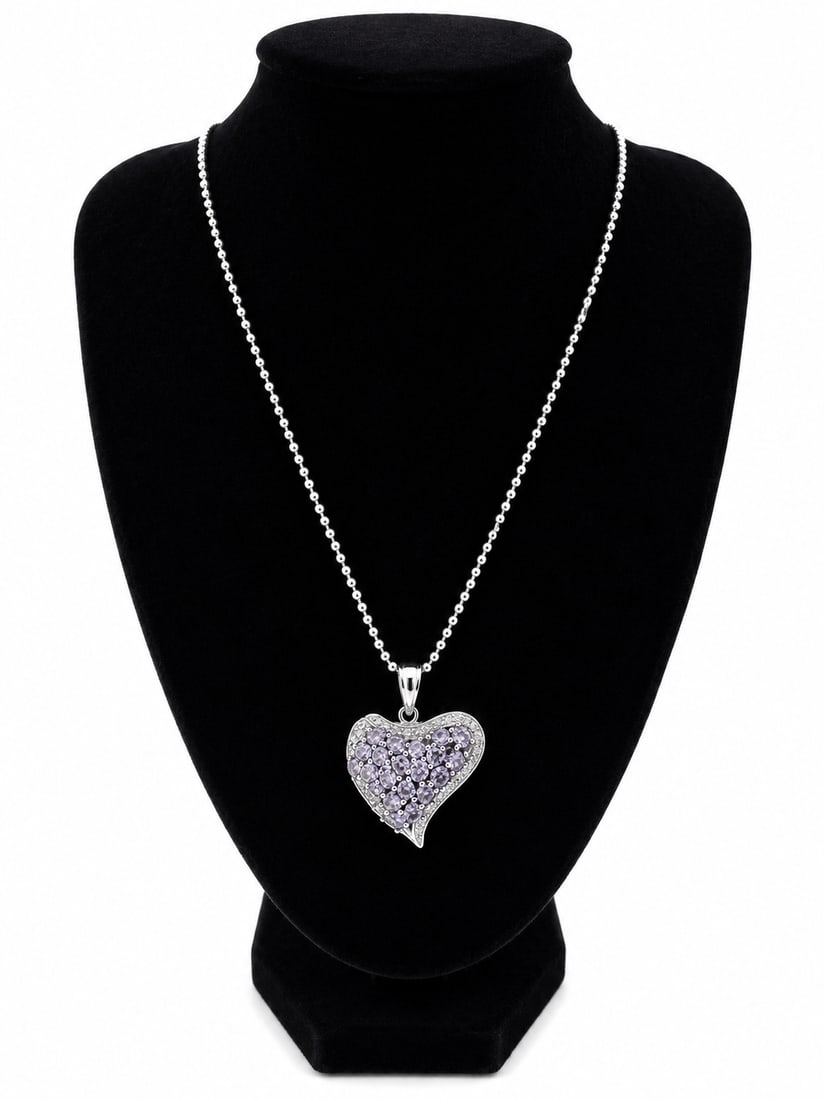 Heart Pendant Necklace with Violet Stones: Heart-shaped pendant necklace featuring round purple-colored stones and clear accent stones. Ships from Newport Beach, CA. Proceeds go to Hoag Hospital Charitable Foundation