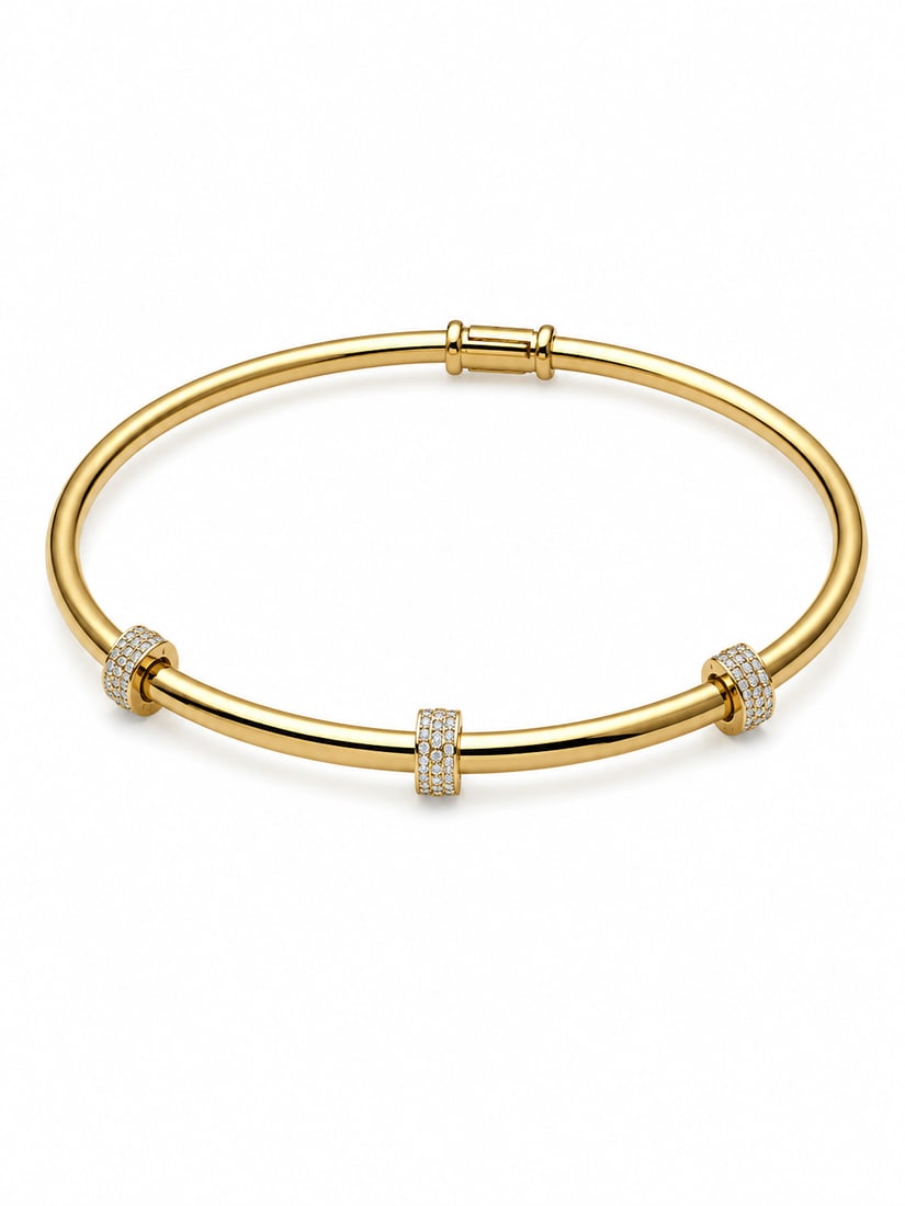 Gold-Tone Crystal Accent Bangle Bracelet: Gold-tone bangle bracelet featuring three crystal-accented stations. Ships from Newport Beach, CA. Proceeds go to Hoag Hospital Charitable Foundation