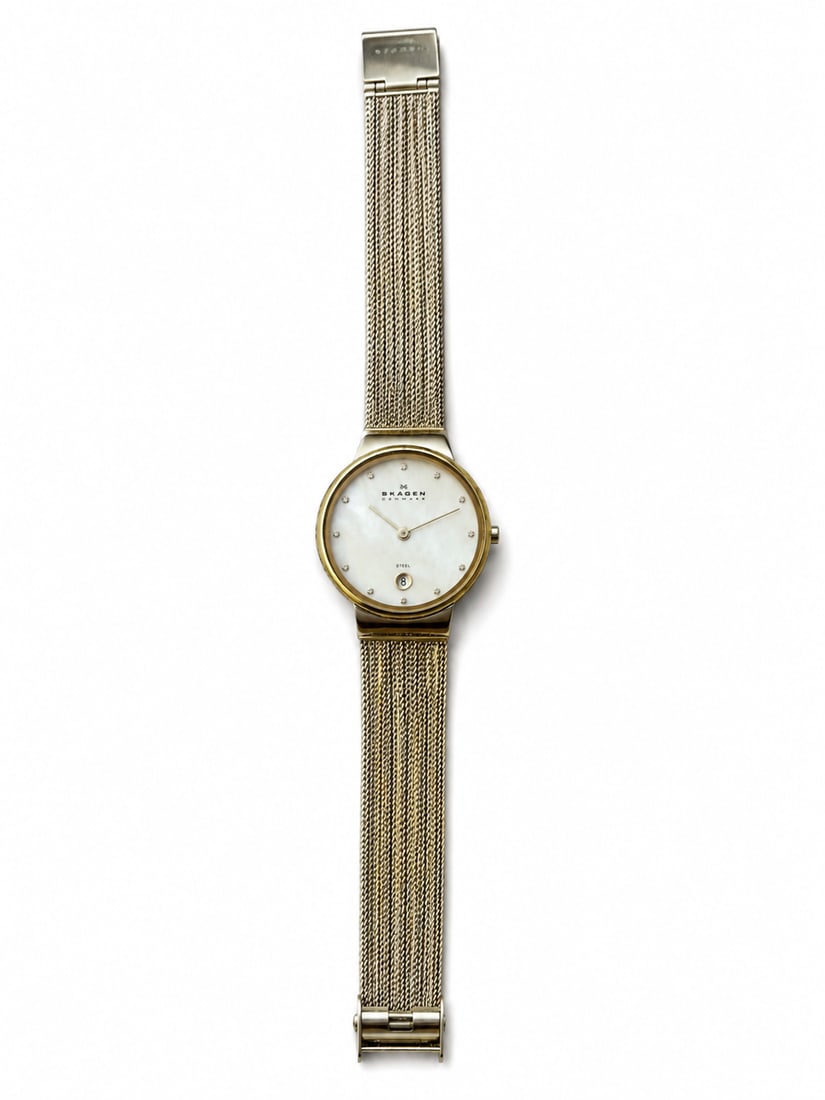 Skagen Denmark Two-Tone Stainless Steel Mesh Watch: Skagen Denmark wristwatch with a mother-of-pearl dial, crystal hour markers, date display, and two-tone stainless steel mesh band.Ships from Newport Beach, CA. Proceeds go to Hoag Hospital Charitable 