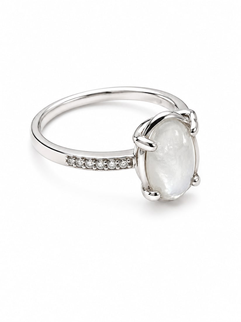 Silver-Tone Oval White Stone Ring: Silver-tone ring featuring an oval white cabochon-style stone in a polished prong setting. Ships from Newport Beach, CA. Proceeds go to Hoag Hospital Charitable Foundation.