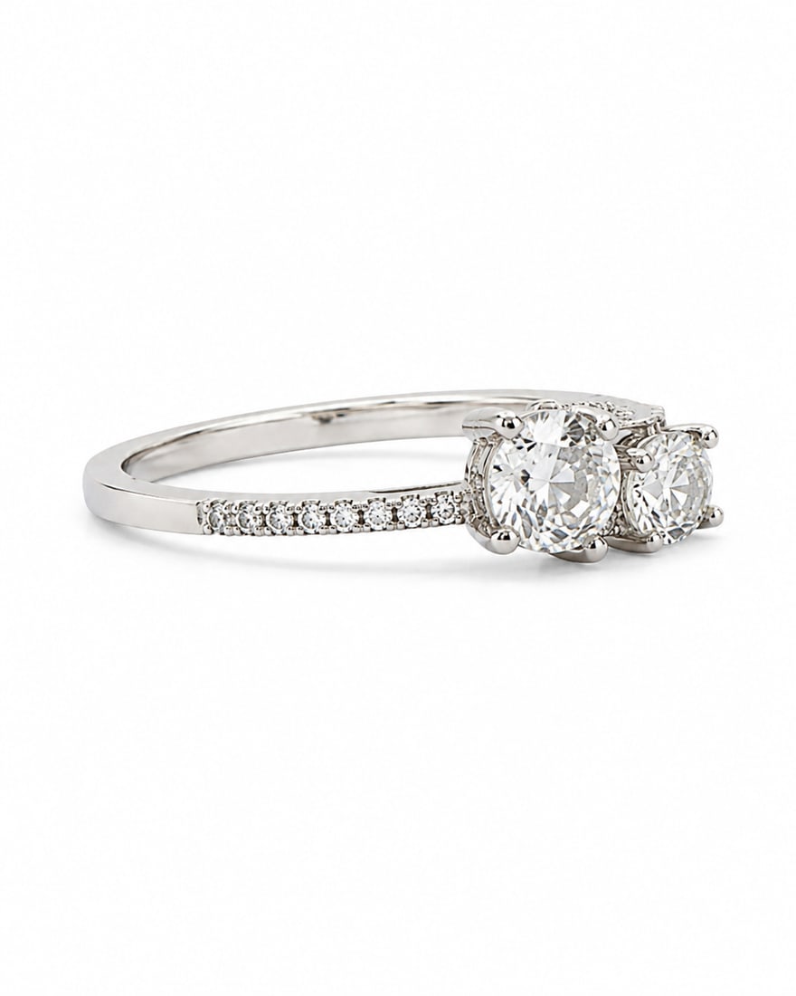 Silver-Tone Two-Stone Crystal Ring: Silver-tone ring featuring two round clear crystal accents with a polished band and pavé crystal details. Ships from Newport Beach, CA. Proceeds go to Hoag Hospital Charitable Foundation.