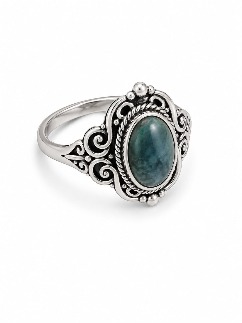 Silver-Tone Vintage Style Ring with Blue Oval Stone: Silver-tone vintage-style ring featuring an oval blue stone with ornate scrollwork detailing. Ships from Newport Beach, CA. Proceeds go to Hoag Hospital Charitable Foundation.