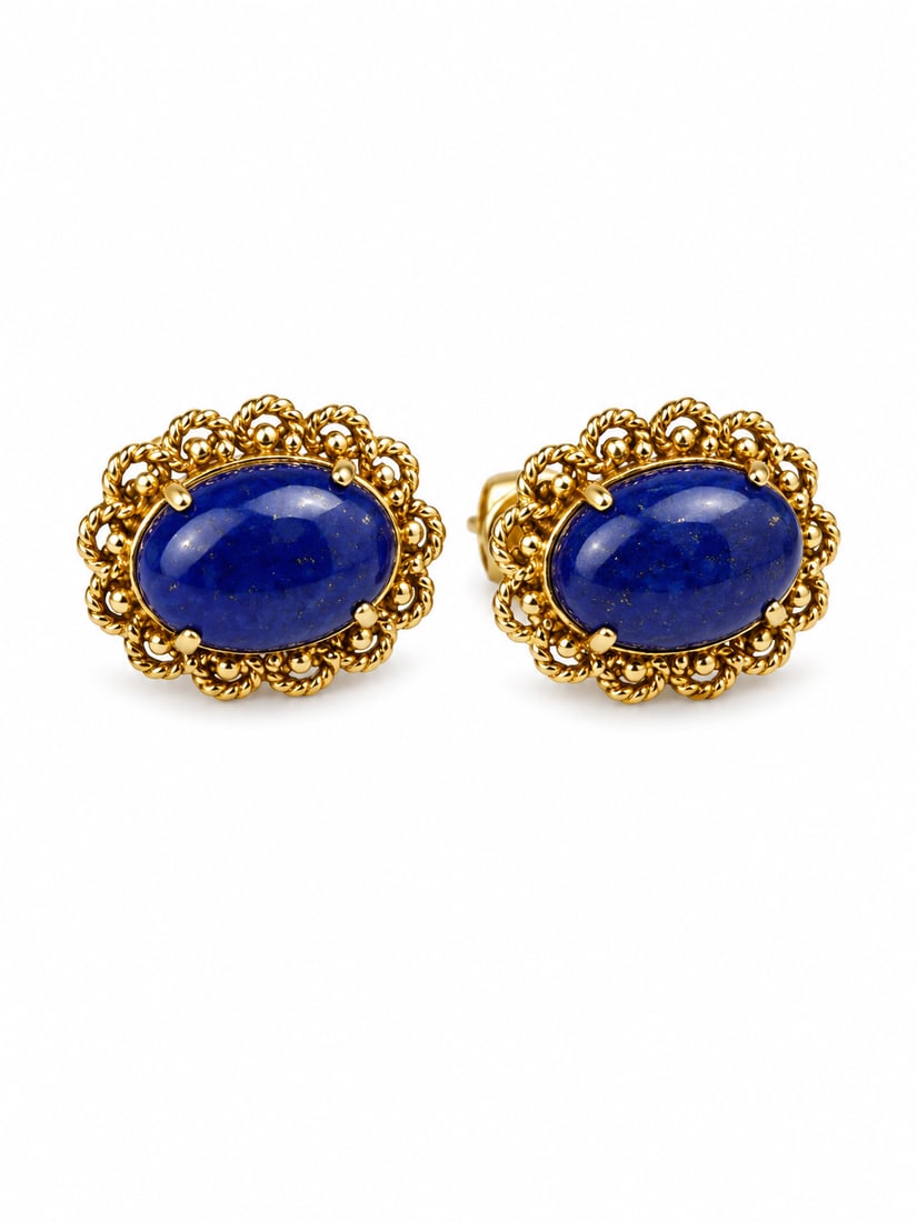 14K Gold Lapis Lazuli Cabochon Earrings: 14K yellow gold earrings featuring oval blue lapis lazuli cabochons with ornate rope and bead-style detailing. Designed with hinged clip-style backs. Ships from Newport Beach, CA.