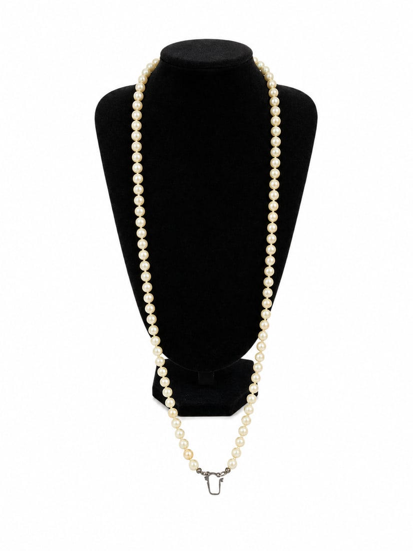 Long Pearl Necklace with Gold Eagle Pendant: Long strand pearl necklace featuring cream-colored pearls with a detailed gold eagle pendant and decorative clasp. Ships from Newport Beach, CA.