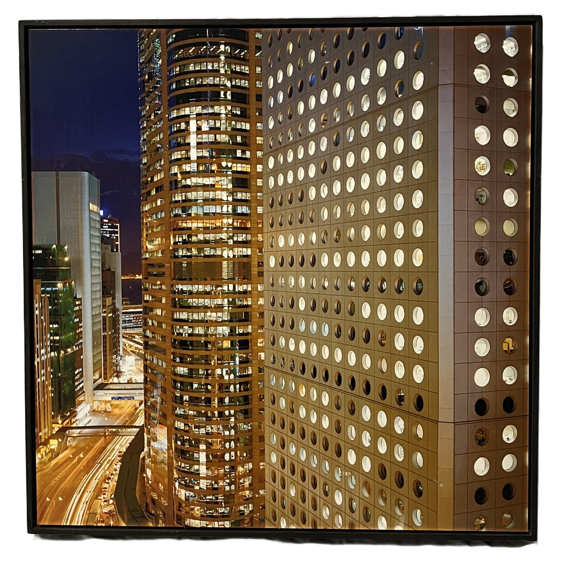Architectural Nightscape | Print on Metal: Architectural Nightscape | Print on Metal Description A contemporary photographic print on metal capturing a bustling urban night scene, highlighting illuminated skyscrapers, light trails from street