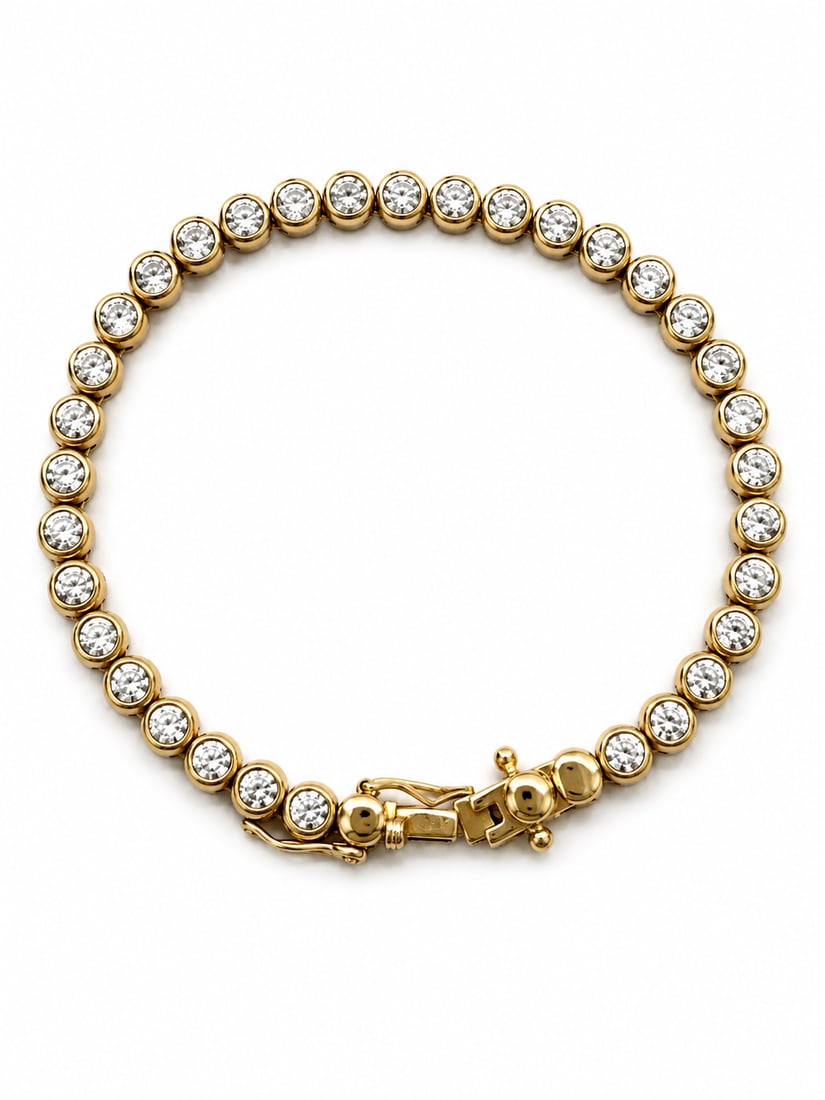 Gold Clear Stone Tennis Bracelet: Gold tennis-style bracelet featuring a continuous row of round clear stones in bezel-style settings with a secure clasp. Ships from Newport Beach, CA. Proceeds go to Hoag Hospital Charitable