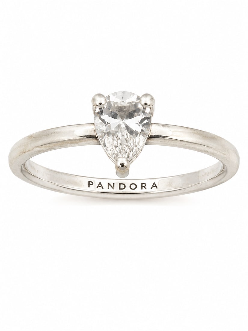 Silver Pandora Solitaire Clear Stone Ring: Pandora ring featuring a polished silver band with a single round clear stone in a classic solitaire style setting. Pandora branding is visible inside the band. Ships from Newport Beach, CA. Proceeds