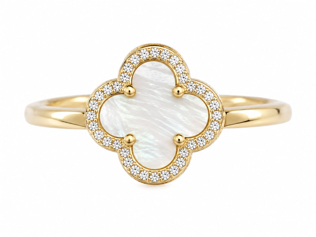 Gold Pearl Clover Ring: Gold ring featuring a four-leaf clover design with a mother-of-pearl style center surrounded by clear accent stones. Ships from Newport Beach, CA. Proceeds go to Hoag Hospital Charitable Foundation.