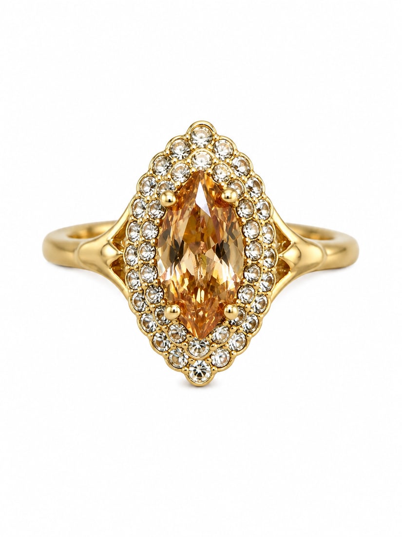 Gold Marquise Champagne Stone Halo Ring: Gold-tone ring featuring a marquise cut champagne colored center stone surrounded by a double halo of clear accent stones. Ships from Newport Beach, CA. Proceeds go to Hoag Hospital Charitable