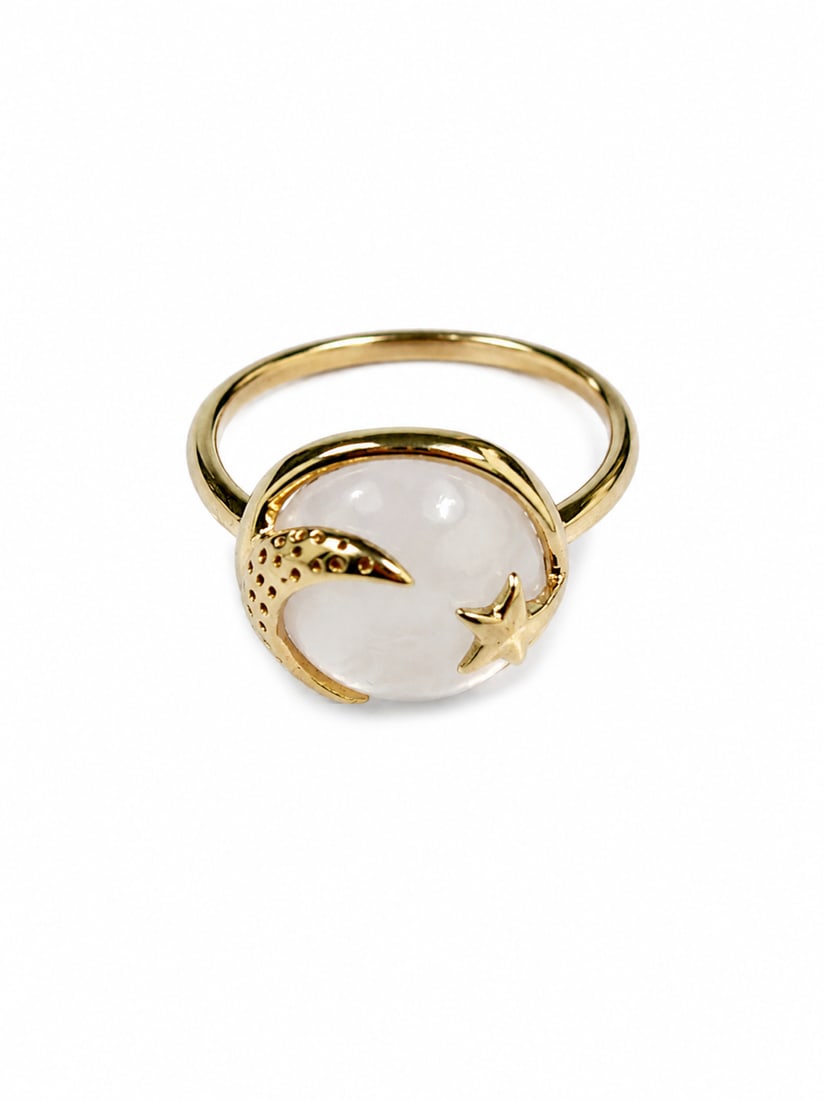 Gold Ring with Mother-of-Pearl Moon & Star Medallion: Gold ring featuring a round mother-of-pearl center with raised crescent moon and star detailing. The celestial design is framed in a polished gold setting on a slim band. Size 9. Ships from Newport