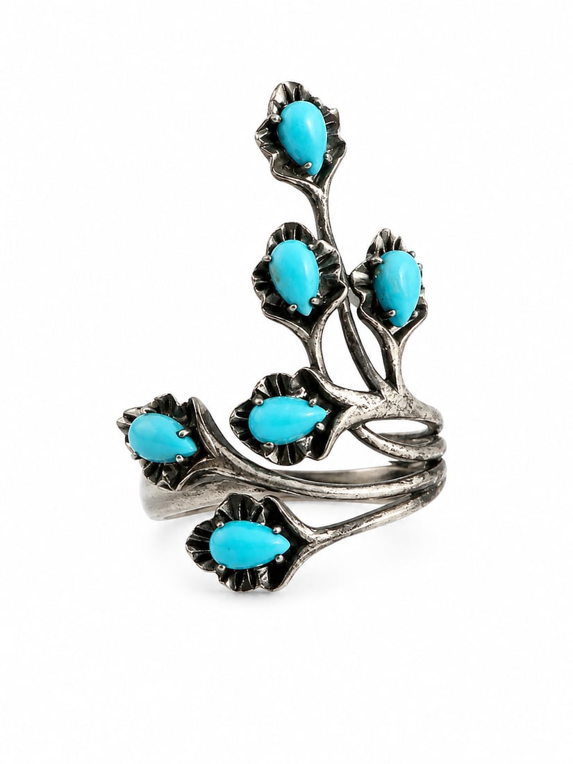 Sterling Turquoise Floral Vine Statement Ring: 925 sterling silver statement ring featuring six turquoise-blue teardrop cabochon stones in sculpted floral settings. The openwork design forms an organic branching vine that extends above and wraps a