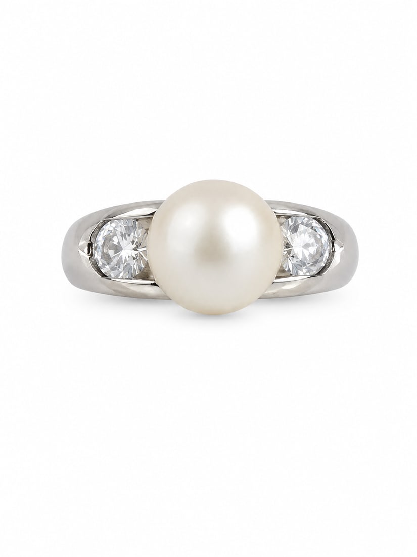 Sterling Pearl & Clear Stone Ring: sterling silver ring featuring a large white pearl center accented by two round clear stones, one on each side. The polished silver band has a sleek, open setting that highlights the center pearl and