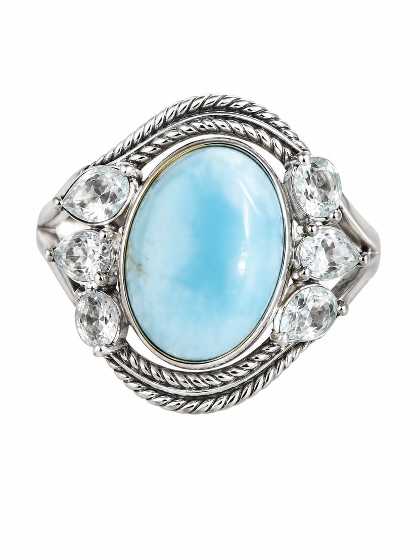 Silver Larimar & White Topaz Statement Ring: Silver statement ring featuring a large oval larimar cabochon center stone in soft Caribbean blue, surrounded by faceted pear and round-cut white topaz stones. Twisted rope detailing frames the center