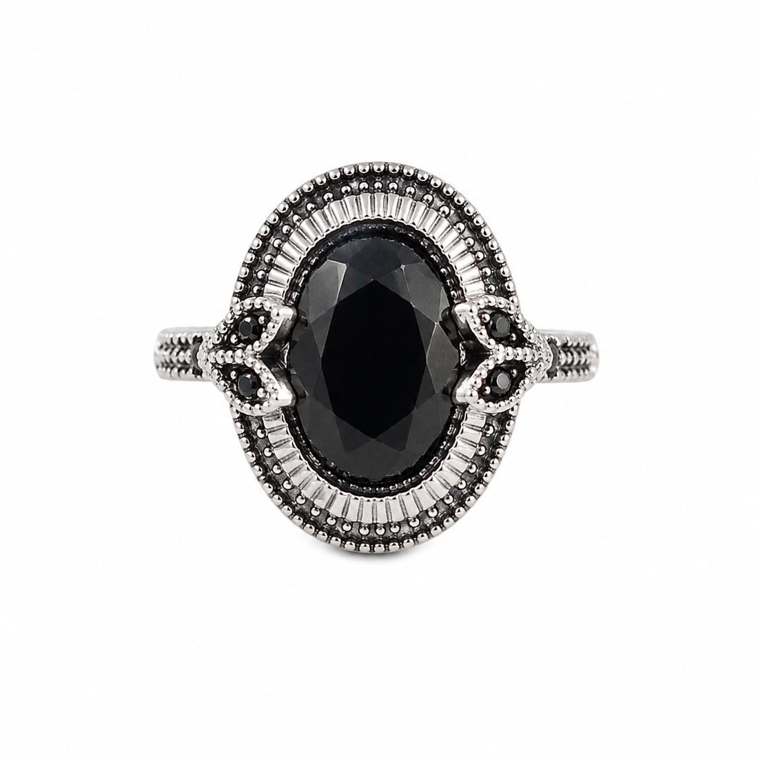 Black Onyx 925 Silver Ornate Statement Ring: Silver ring featuring a large oval-cut black onyx center stone surrounded by ornate beaded and textured detailing. Smaller black accent stones decorate each side, giving the ring a bold vintage-inspir