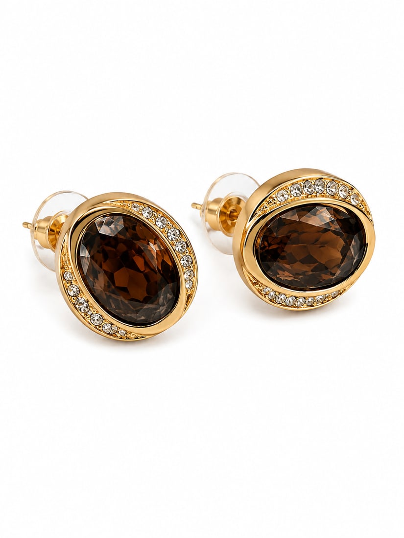 Smoky Quartz & White Stone Gold Oval Stud Earrings: Gold oval stud earrings featuring large faceted smoky quartz center stones framed by round white accent stones. The layered oval setting and warm brown gemstones create an elegant, classic design. Fin