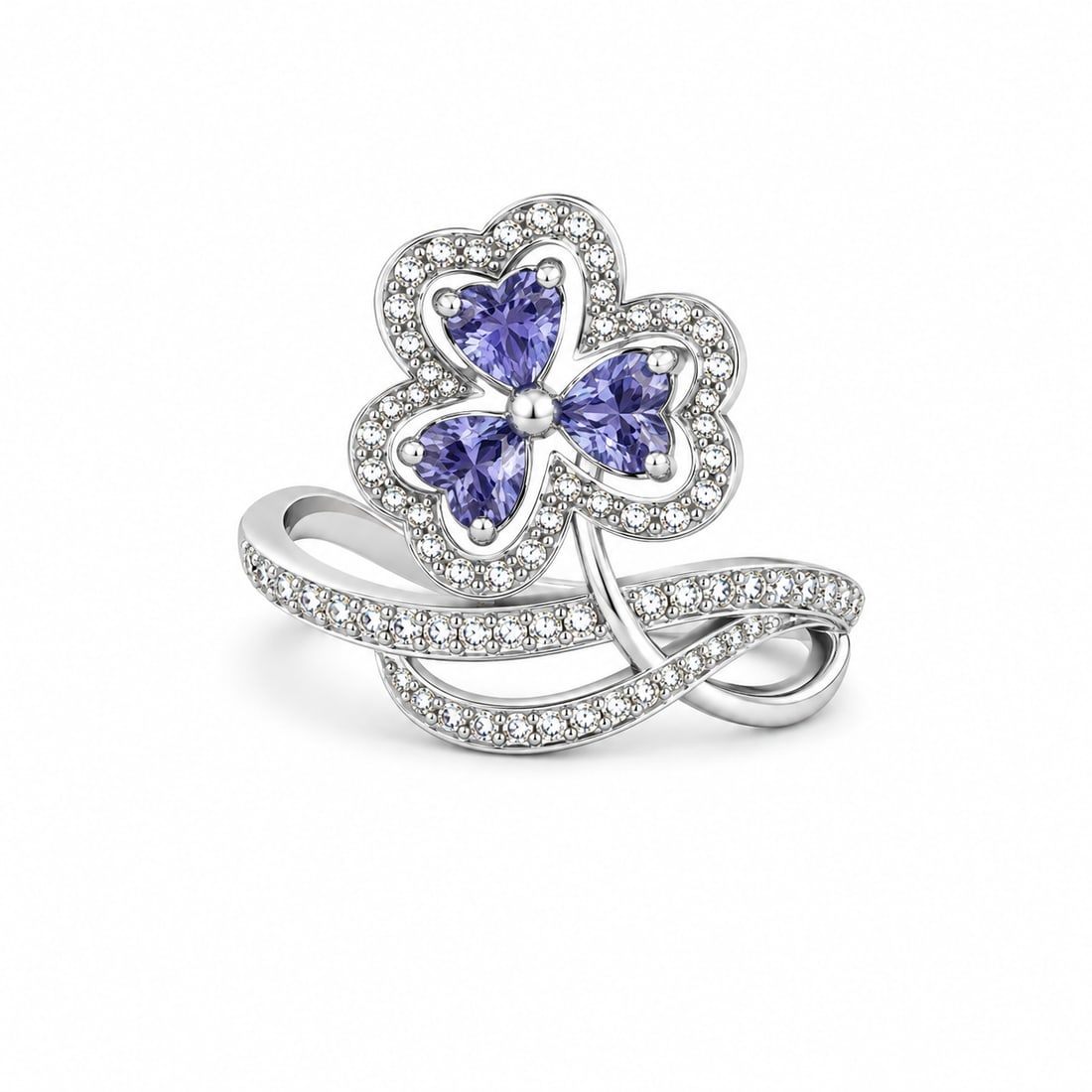 Tanzanite & CZ Sterling Silver Statement Ring: Sterling silver ring featuring a clover-inspired floral design with three heart-cut tanzanite stones accented by round cubic zirconia. The sweeping split-band design is lined with additional CZ