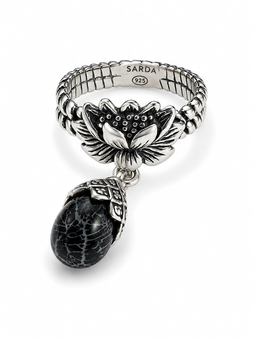 SARDA 925 Sterling Silver Lotus & Black Stone Dangle Ring: SARDA sterling silver ring featuring a detailed lotus flower centerpiece and a dangling black patterned teardrop stone. Sculpted floral and leaf detailing with oxidized accents creates an ornate dimen