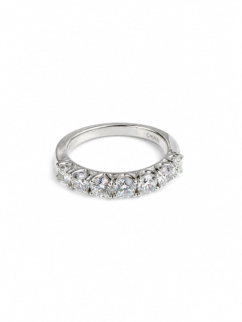 Sterling Round CZ Anniversary Band Ring: 925 sterling silver ring featuring a graduated row of brilliant round-cut CZ stones in classic prong settings. The larger center stones taper slightly toward the sides, creating an elegant anniversary