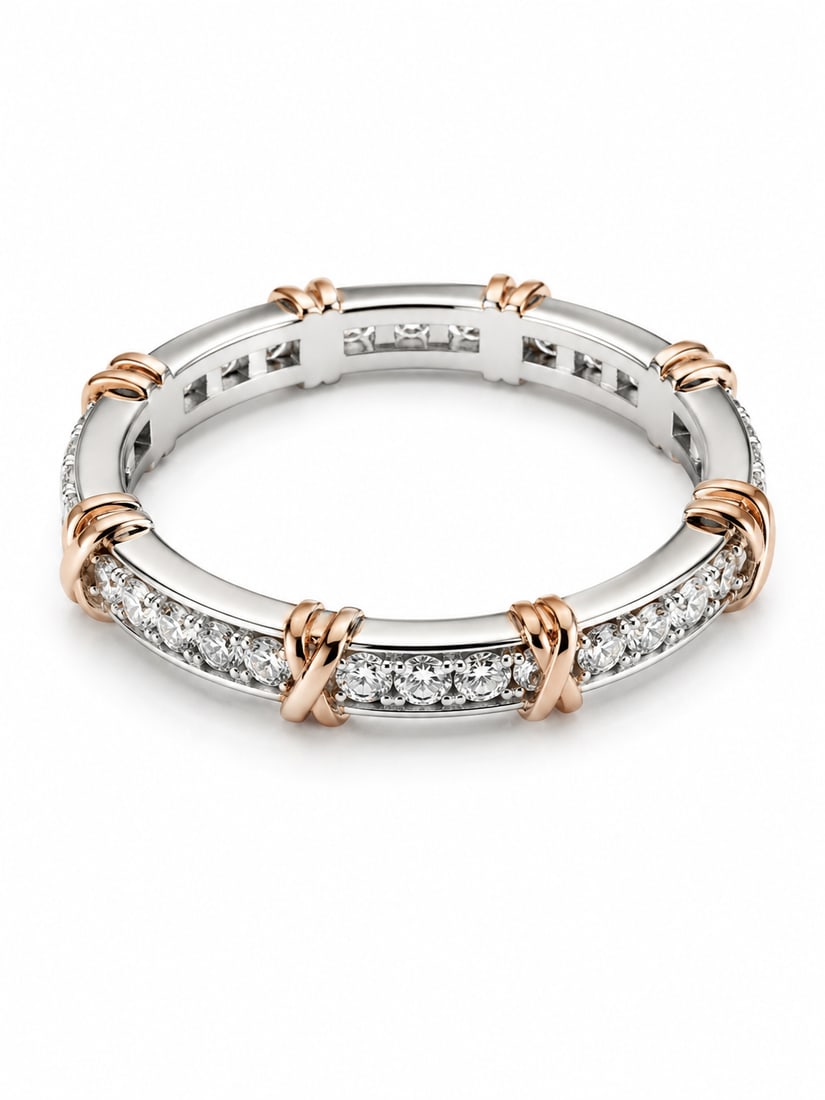 Sterling Two-Tone CZ Eternity Band Ring: 925 sterling silver ring featuring a continuous row of round CZ stones accented by rose gold crossover details. Two-tone openwork design with repeating polished sections around the band. Size: 9 Marki