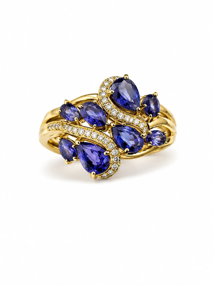 Tanzanite & CZ 925 Sterling Silver Gold Ring: 925 sterling silver ring with a gold finish, featuring a flowing arrangement of oval and pear-cut tanzanite stones. Curved rows of cubic zirconia accents weave through the design for added brilliance