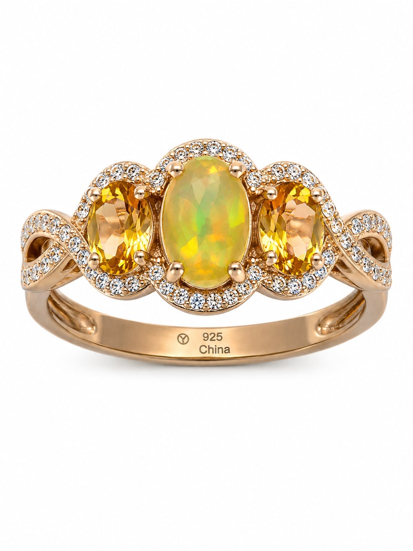 Fire Opal & Citrine 925 Sterling Silver Gold Ring: Gold ring featuring a vibrant oval fire opal center stone with glowing yellow, orange, and green flashes, flanked by two oval-cut golden citrine stones. Sparkling CZ halo accents surround the gemstone