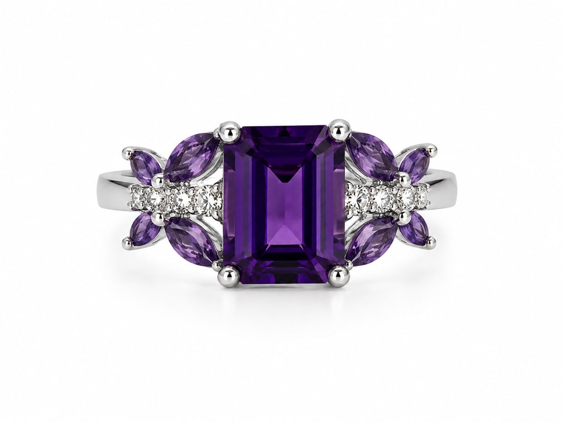 Emerald-Cut Amethyst 925 Sterling Silver Ring: Sterling silver ring featuring a large emerald-cut deep purple amethyst center stone accented by marquise-cut amethysts along each side. Rows of sparkling white CZ accents complete the symmetrical flo