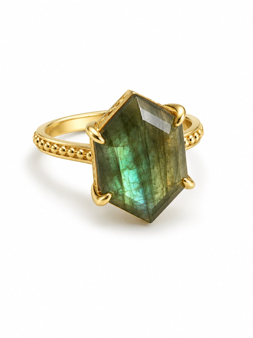 Gold Labradorite Statement Ring with Geometric Faceted Stone: Gold ring featuring a large geometric-cut labradorite centerpiece with deep olive-green coloring and vivid blue-green iridescent flashes. The elongated angular stone is secured in a four-prong