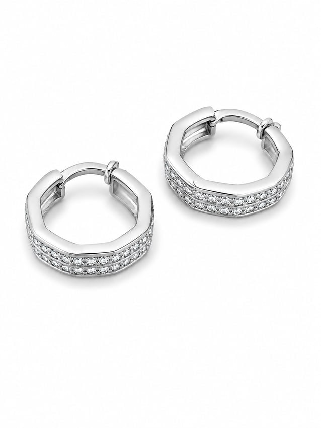 Silver Crystal Hexagon Hoop Earrings: Silver hexagon hoop earrings featuring rows of clear crystal accents and secure hinged closures. Ships from Newport Beach, CA. Proceeds go to Hoag Hospital Charitable Foundation Previous Lot: 124