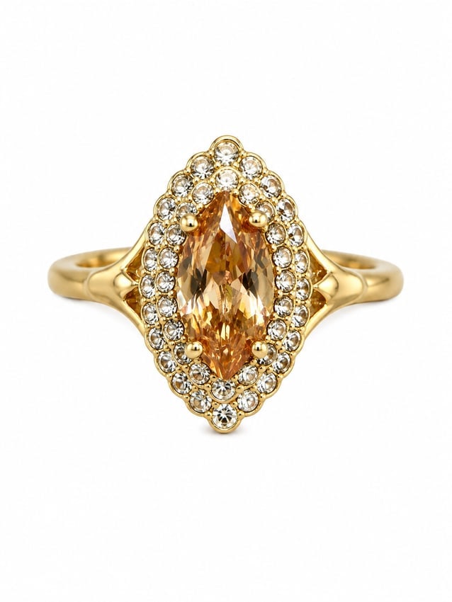 Gold Marquise Champagne Stone Halo Ring: Gold-tone ring featuring a marquise cut champagne colored center stone surrounded by a double halo of clear accent stones. Ships from Newport Beach, CA. Proceeds go to Hoag Hospital Charitable Foundat