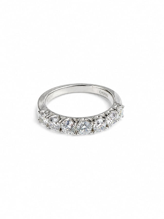 Sterling Round CZ Anniversary Band Ring: 925 sterling silver ring featuring a graduated row of brilliant round-cut CZ stones in classic prong settings. The larger center stones taper slightly toward the sides, creating an elegant anniversary