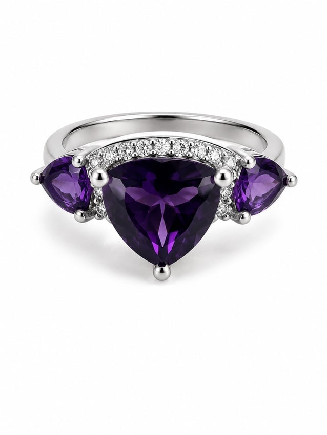Sterling Amethyst Trillion Statement Ring: Striking 925 sterling silver ring featuring a large trillion-cut deep purple amethyst center stone flanked by two pear-cut amethyst side stones. Sparkling white crystal accents curve around the