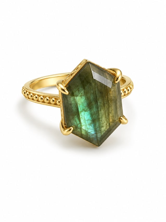 Gold Labradorite Statement Ring with Geometric Faceted Stone: Gold ring featuring a large geometric-cut labradorite centerpiece with deep olive-green coloring and vivid blue-green iridescent flashes. The elongated angular stone is secured in a four-prong