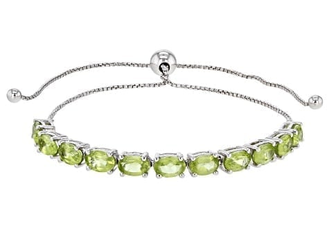 4.40ctw Green Peridot Line Bracelet in Rhodium-Plated Sterling Silver: 4.40ctw Green Peridot Bracelet Fresh and lively 4.40ctw green peridot stones arranged in a bright rhodium over sterling silver bracelet. Ships from Newport Beach, CA.<