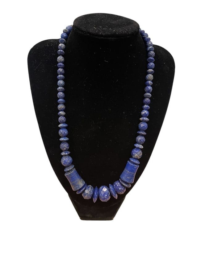 Deep Blue Lapis Lazuli Bead Necklace with Sterling Silver Clasp: Lapis Lazuli Bead Necklace An elegant necklace featuring deep blue lapis lazuli stones, finished with a secure and polished sterling silver clasp. Length: 10 Inch