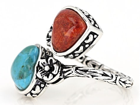 Turquoise and Coral 2-Stone Bypass Ring in Rhodium-Plated Silver: Turquoise & Coral Bypass Ring A striking 2-stone bypass ring featuring vibrant turquoise and coral (10.5x10mm) set in rhodium over sterling silver. Ships from Newport Beac