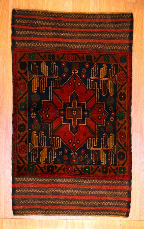 2'10" x 4'9" Baluch: Baluchi rugs are mainly woven by Baluchi tribal weavers in the southwest of Pakistan, northeast of Iran and northwest of Afghanistan.