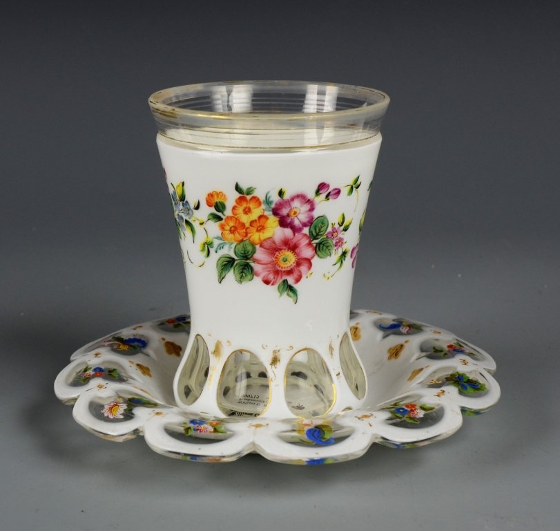Overlay Beaker & Under plate: White glass over clear with decorative cuts to clear. Enameled floral design and gilding. 7.0"dia. & 5.0"ht., Bohemian, circa 1860.