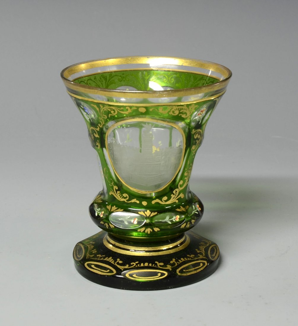 Green Overlay Beaker: Green glass over clear with various facet-cuts to body and base. Whell-cut scene, enamel floral decoration with ornamental gilding 4.25 "ht., Bohemian, circa 1900