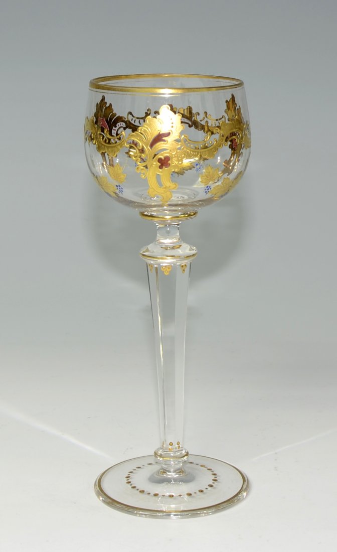 Gilded Wine Goblet: Clear glass wine goblet, 7.4" ht., ornamental and floral gilding with transparent enamel to bowl, facet cut stem and foot gilded. Circa 1900.